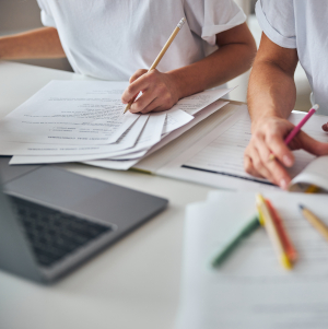 Cropped,Photo,Of,Females,Working,Together,With,Studying,Materials,While